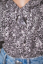 Animal printed ruffle bodysuit top