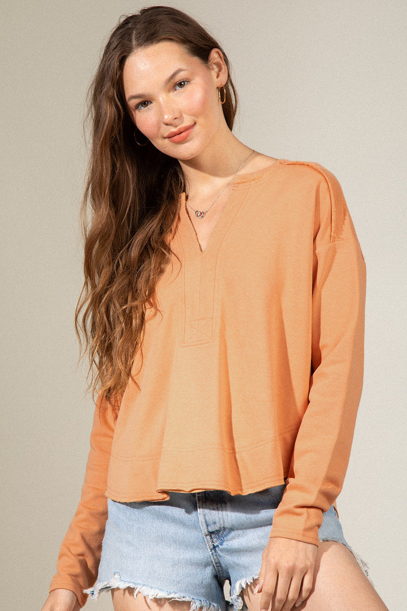 Raw edge detail solid knit top
