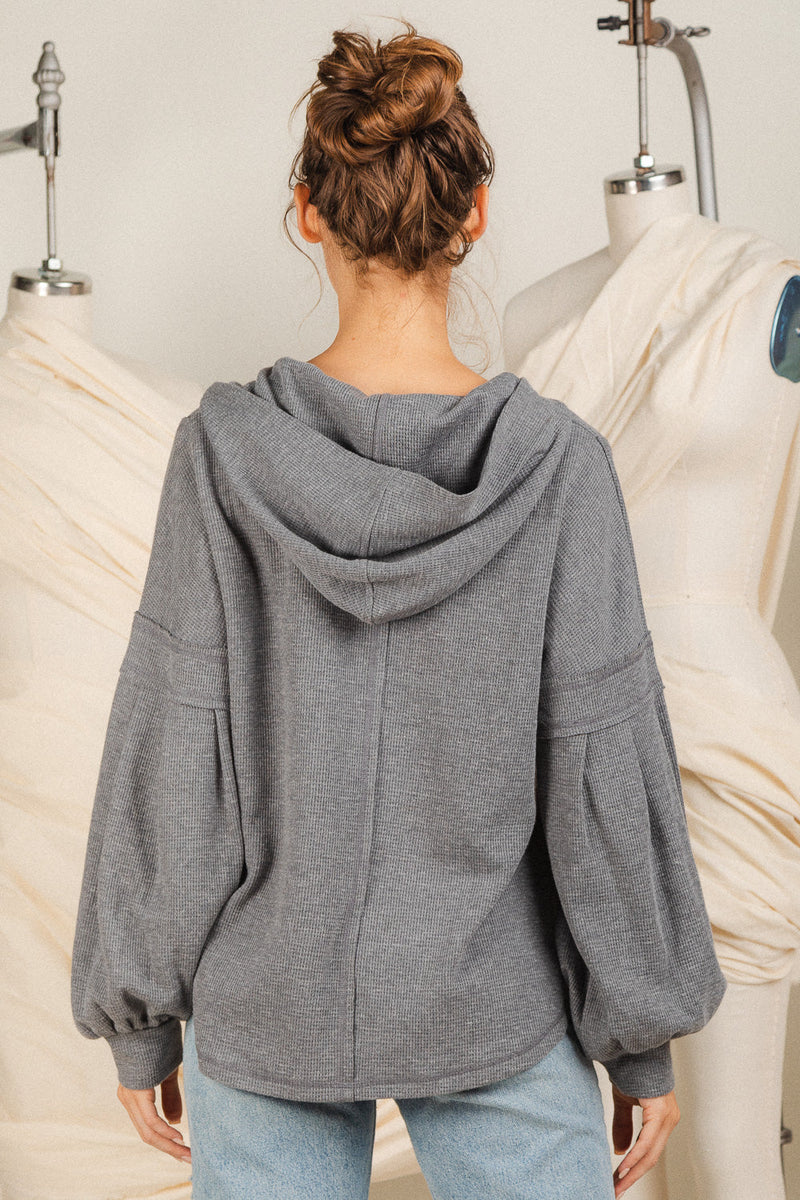 Raw edge detail hooded knit top