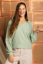 Raglan sleeve hooded knit top